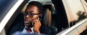 Man drives in car hoping he doesn't have to default on his auto loan