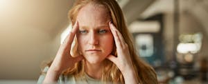 Frustrated woman wondering how to reapply for a credit card after being denied