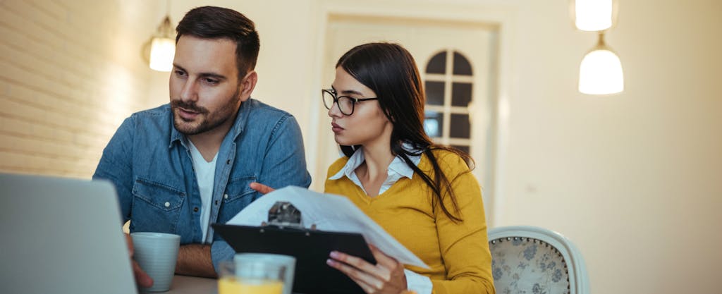 couple looking at mortgage documents