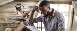 Young man renovating an attic